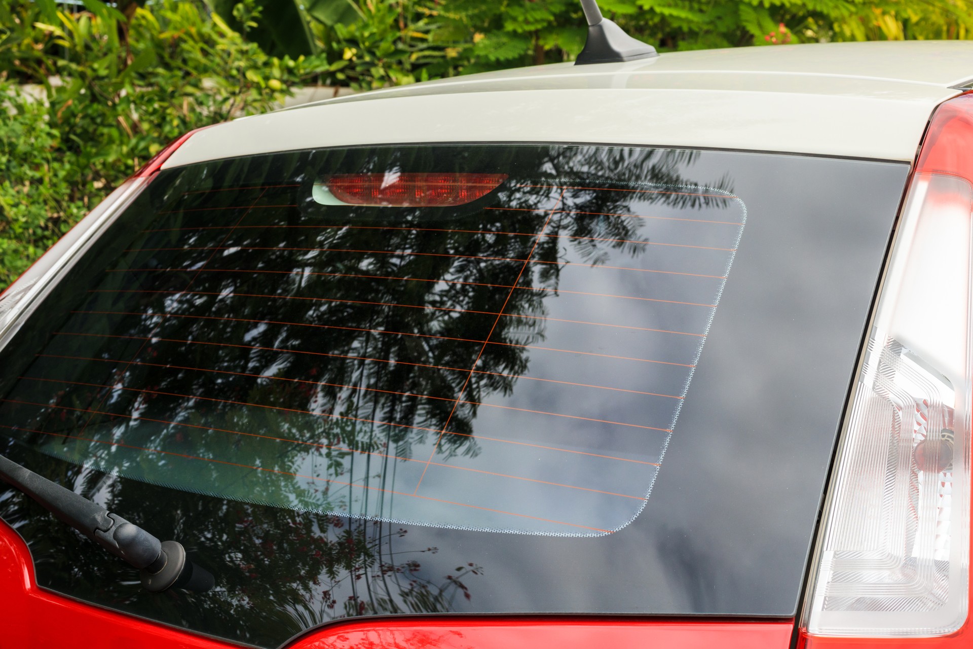 Back view of red car window for sticker mockup