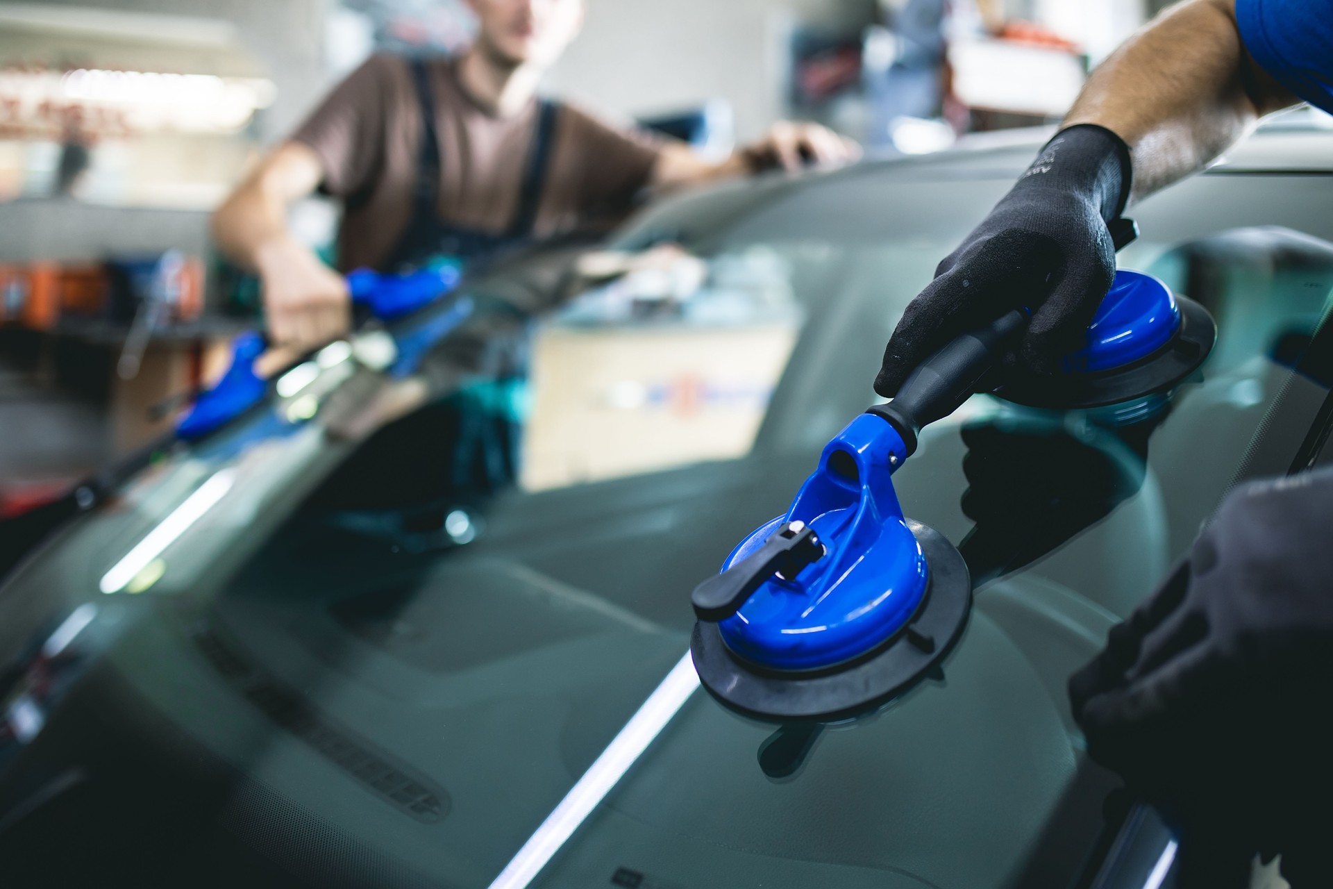 Replacement of car glass in a car service.